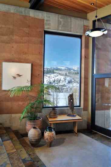 The entry foyer displays Tom and Katherine's collection of antique mediterranean vessels.